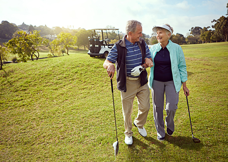 senior golf couple