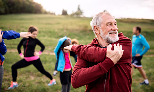 mature man stretching arm