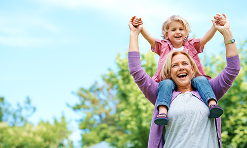 woman lifting grandchild